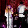 Photos: Mariah Carey Bedazzles Her Cast Sling For Central Park Concert